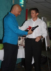 Kurek Ashley accepts gift from David de Closey David de Closey from Oculus Accounting